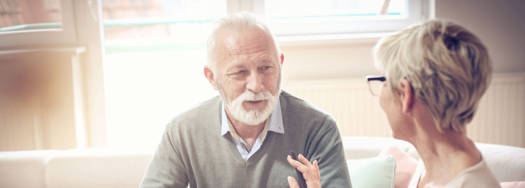 elderly couple having conversation