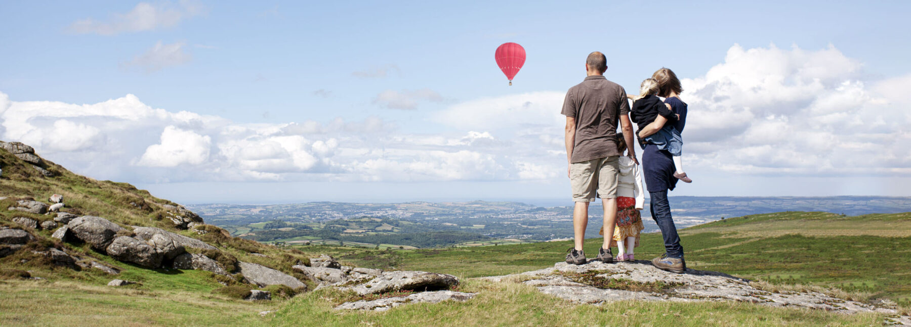 family stood on rock on Dartmoor