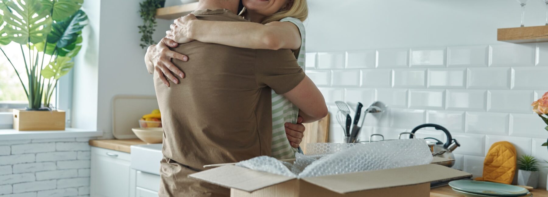 happy couple in kitchen, moving in together