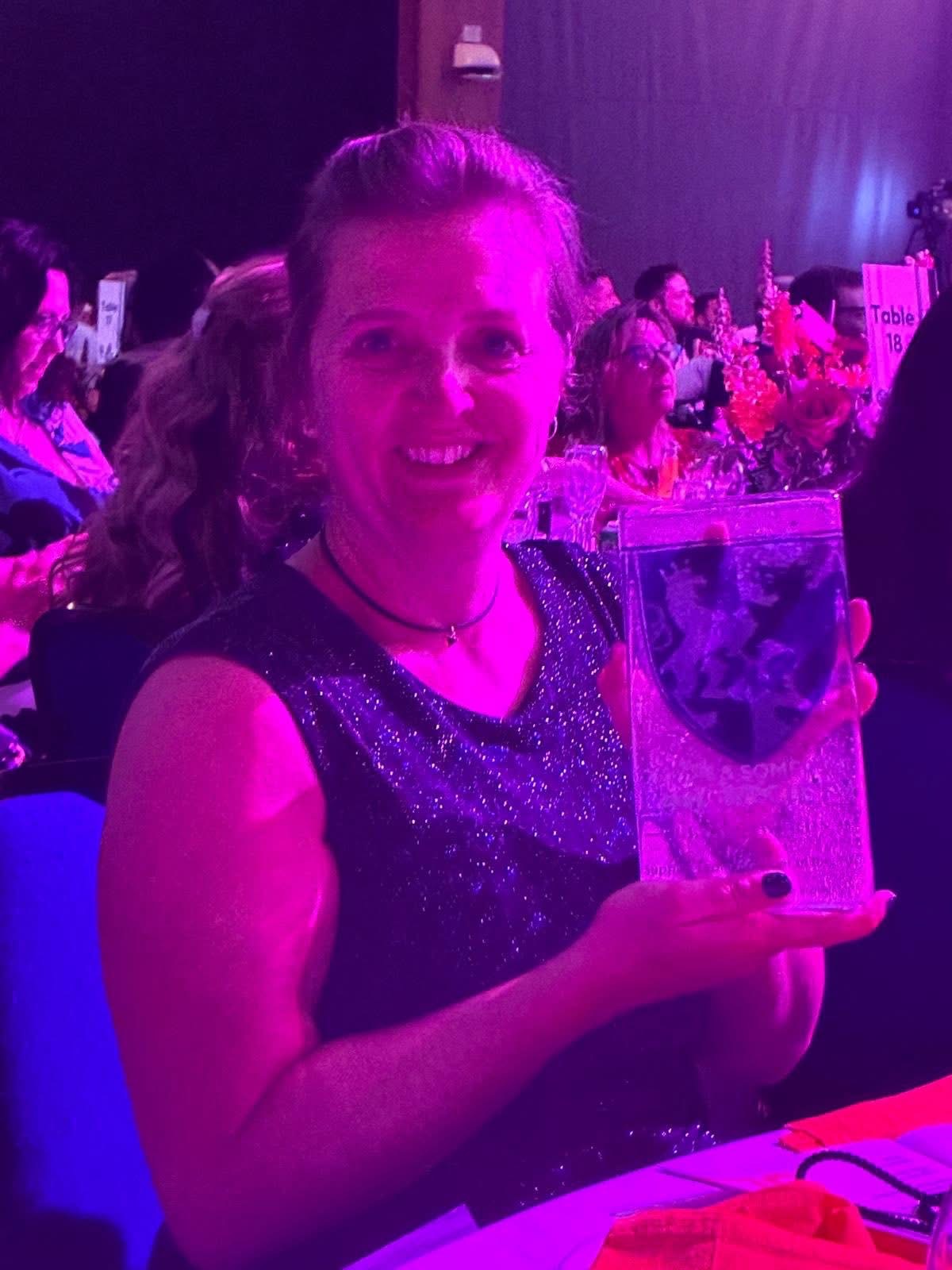 Angie Beresford holding her Devon & Somerset Law Society award