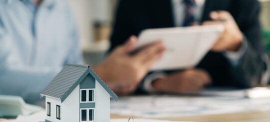 landlord with tenant discussing contract